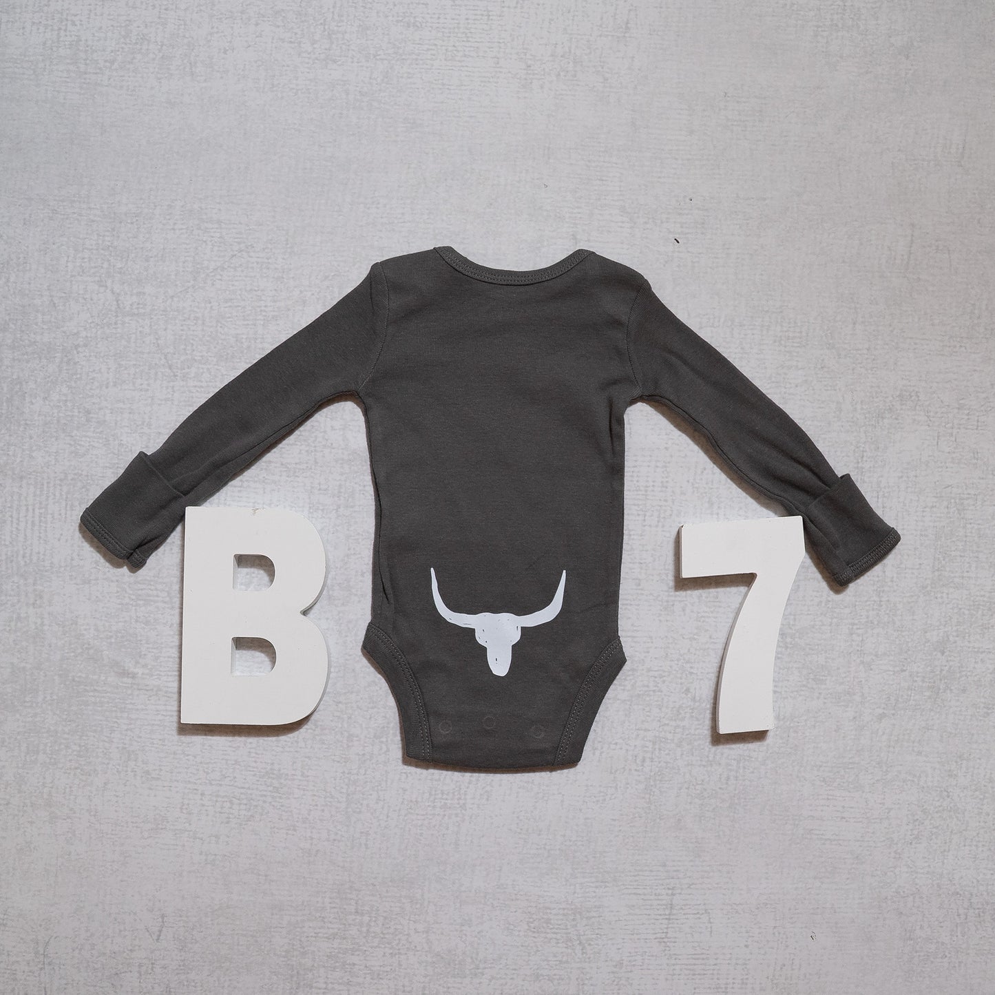 Baby Longhorn Skull – Western Cow Skull Graphic Long Sleeve Onesie