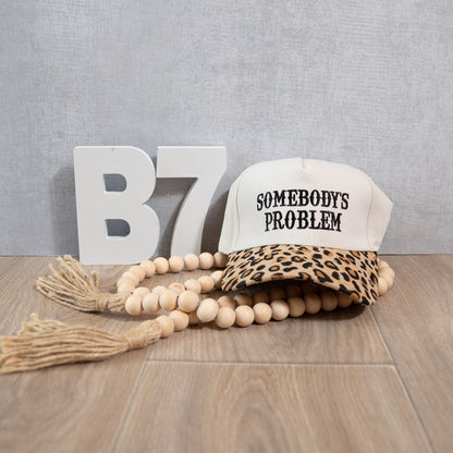 Somebody’s Problem Embroidered Trucker Hat – Bold Statement Western Cap