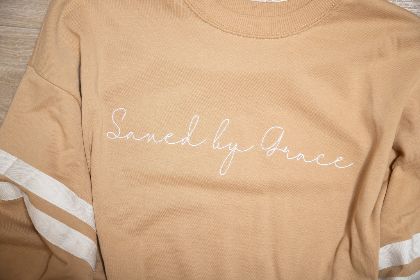 Saved by Grace Embroidered Sweatshirt – Faith Graphic Pullover with Varsity Stripes
