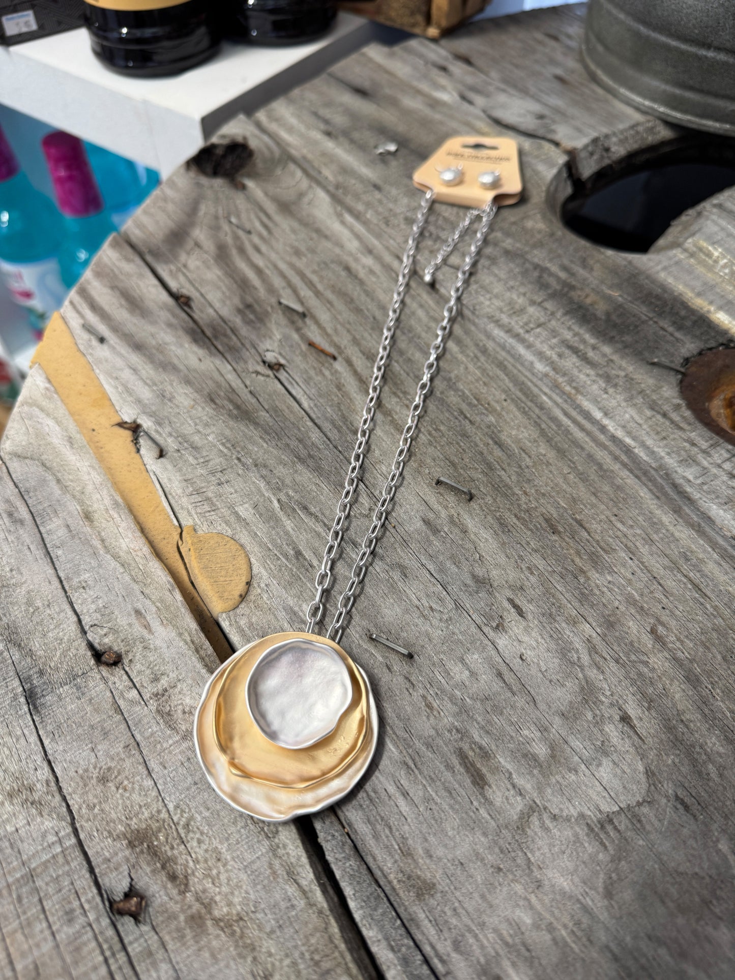 “Layered mixed metal gold and silver necklace”

“Dish Me Up mixed metal layered chain from B7 Boutique”

“Two-tone chain necklace with gold accents and silver links”