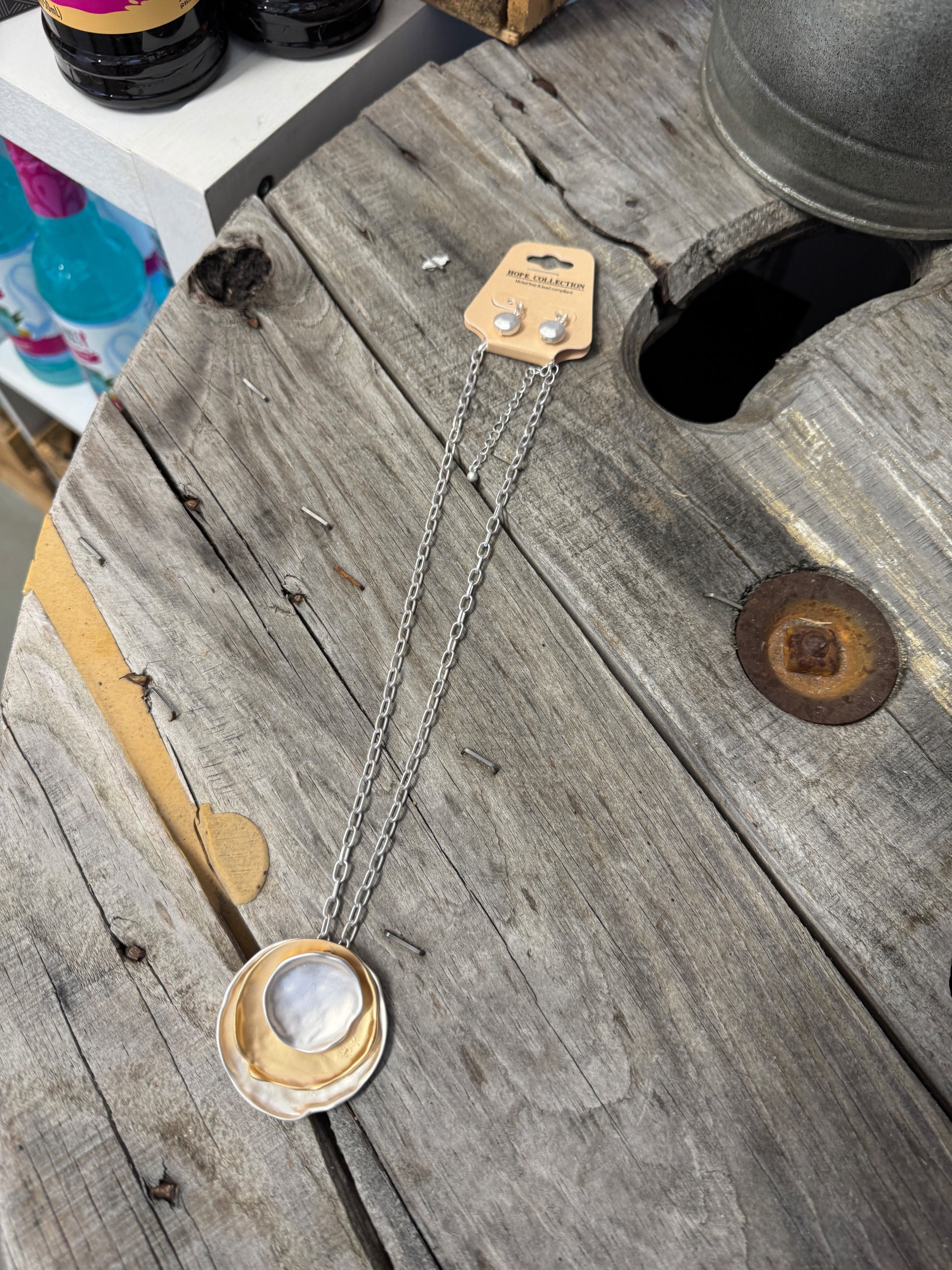 “Layered mixed metal gold and silver necklace”

“Dish Me Up mixed metal layered chain from B7 Boutique”

“Two-tone chain necklace with gold accents and silver links”