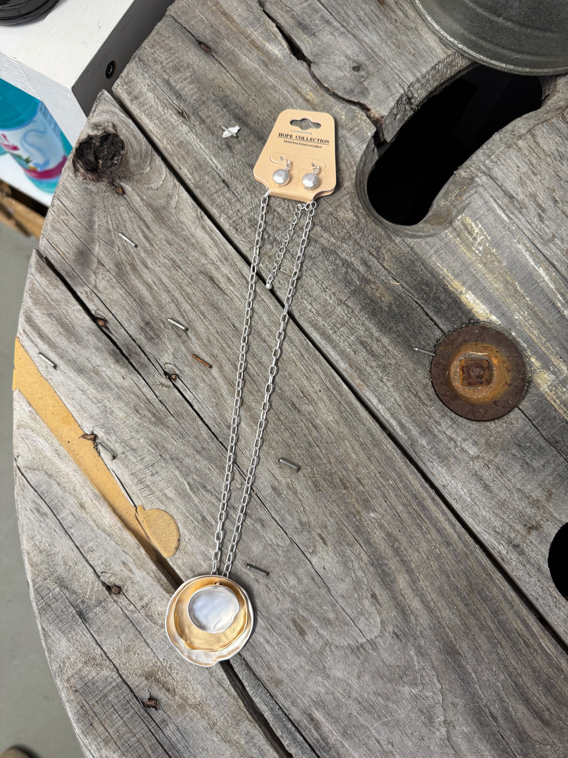 “Layered mixed metal gold and silver necklace”

“Dish Me Up mixed metal layered chain from B7 Boutique”

“Two-tone chain necklace with gold accents and silver links”