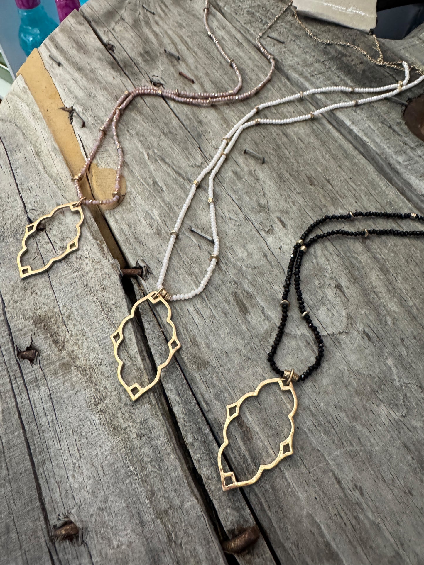 “Dainty Days beaded necklace in pink”

“Elegant black beaded chain necklace from B7 Boutique”

“White subtle beaded necklace, perfect for layering”