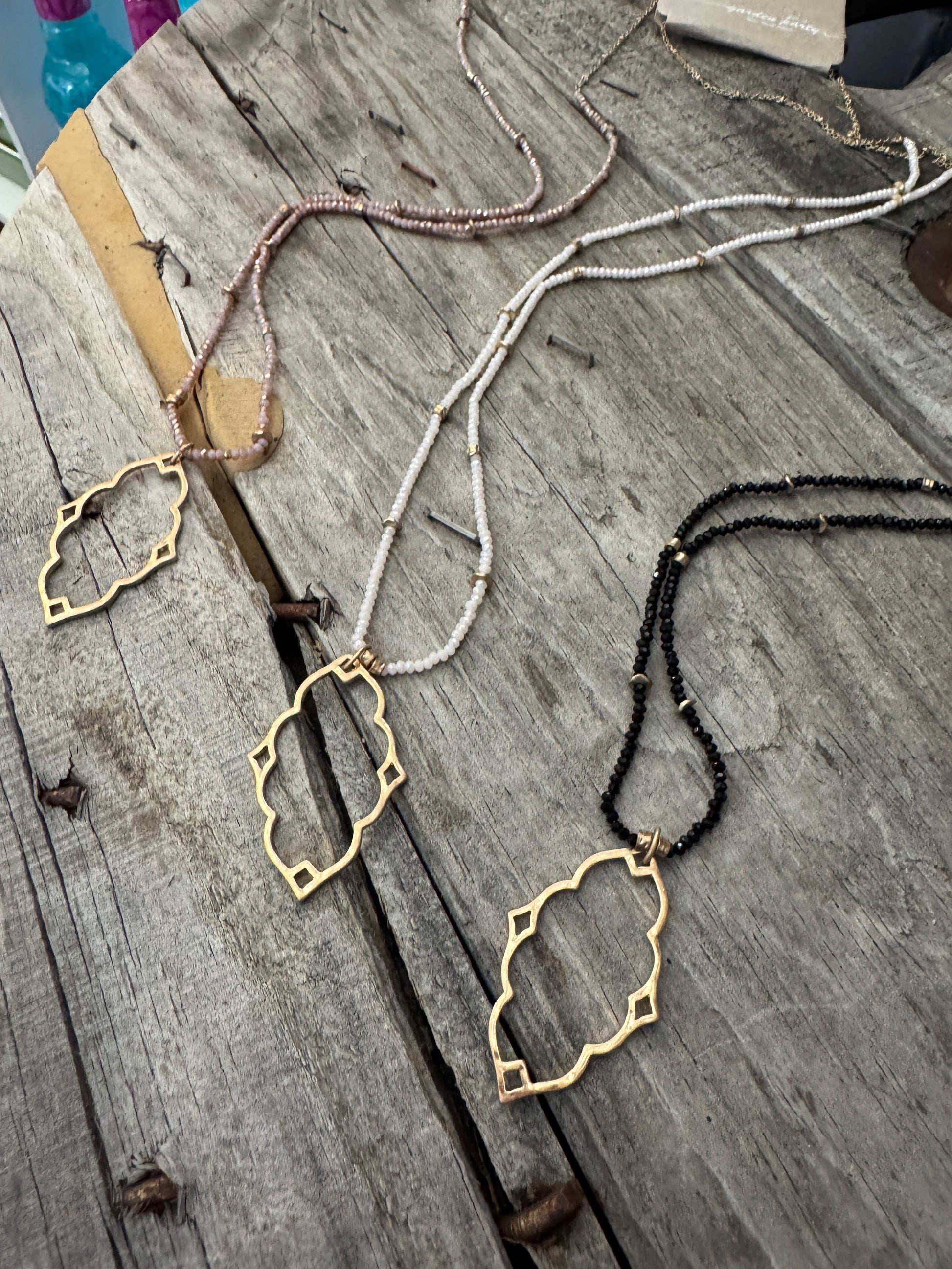 “Dainty Days beaded necklace in pink”

“Elegant black beaded chain necklace from B7 Boutique”

“White subtle beaded necklace, perfect for layering”