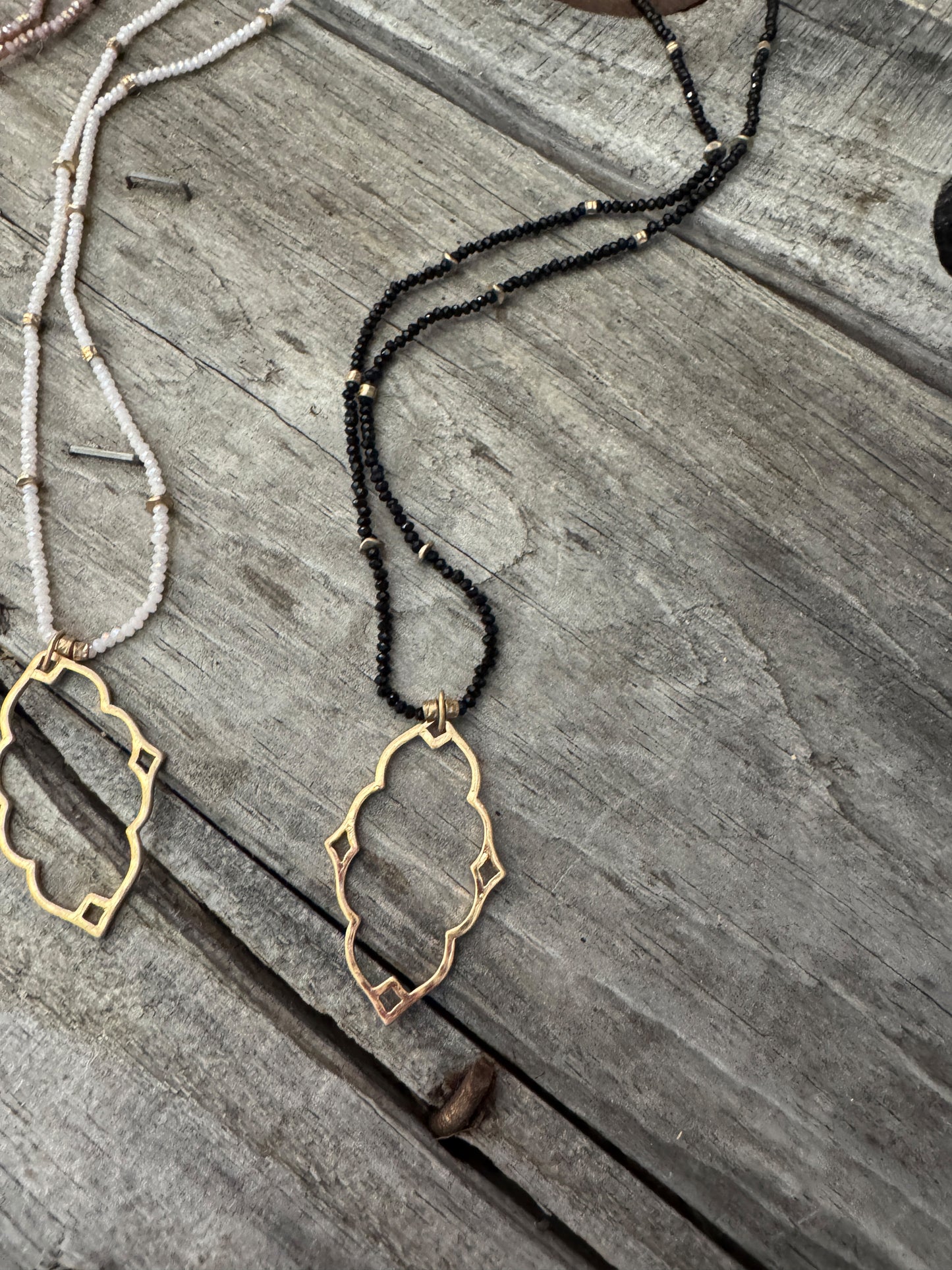 “Dainty Days beaded necklace in pink”

“Elegant black beaded chain necklace from B7 Boutique”

“White subtle beaded necklace, perfect for layering”