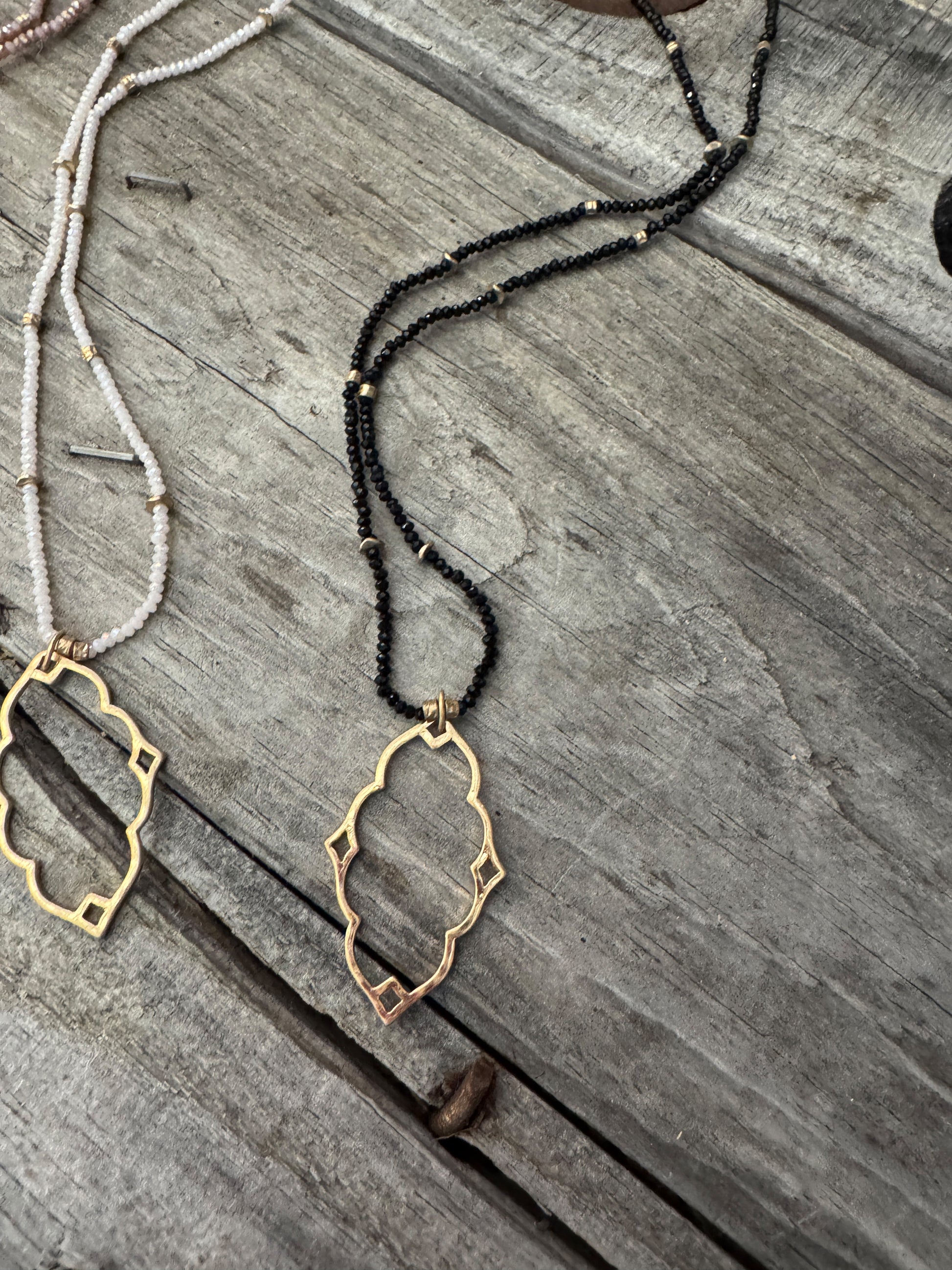 “Dainty Days beaded necklace in pink”

“Elegant black beaded chain necklace from B7 Boutique”

“White subtle beaded necklace, perfect for layering”