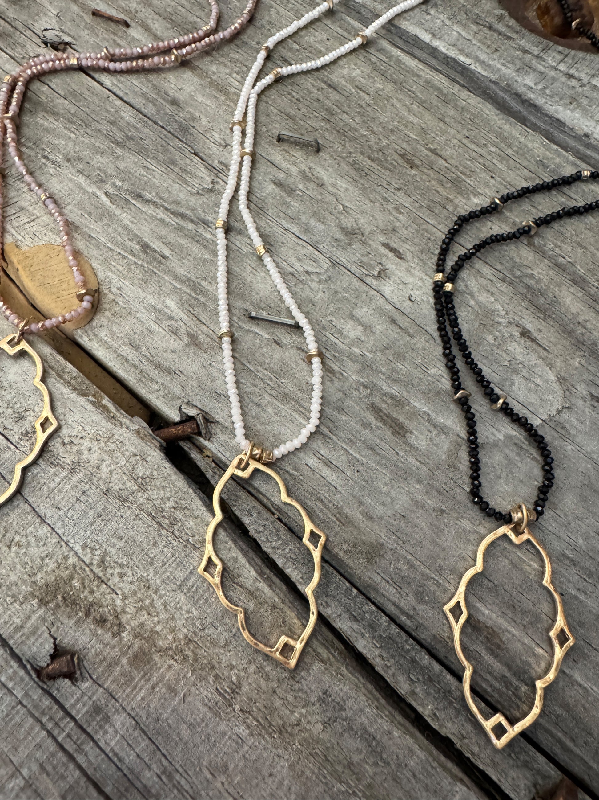 “Dainty Days beaded necklace in pink”

“Elegant black beaded chain necklace from B7 Boutique”

“White subtle beaded necklace, perfect for layering”