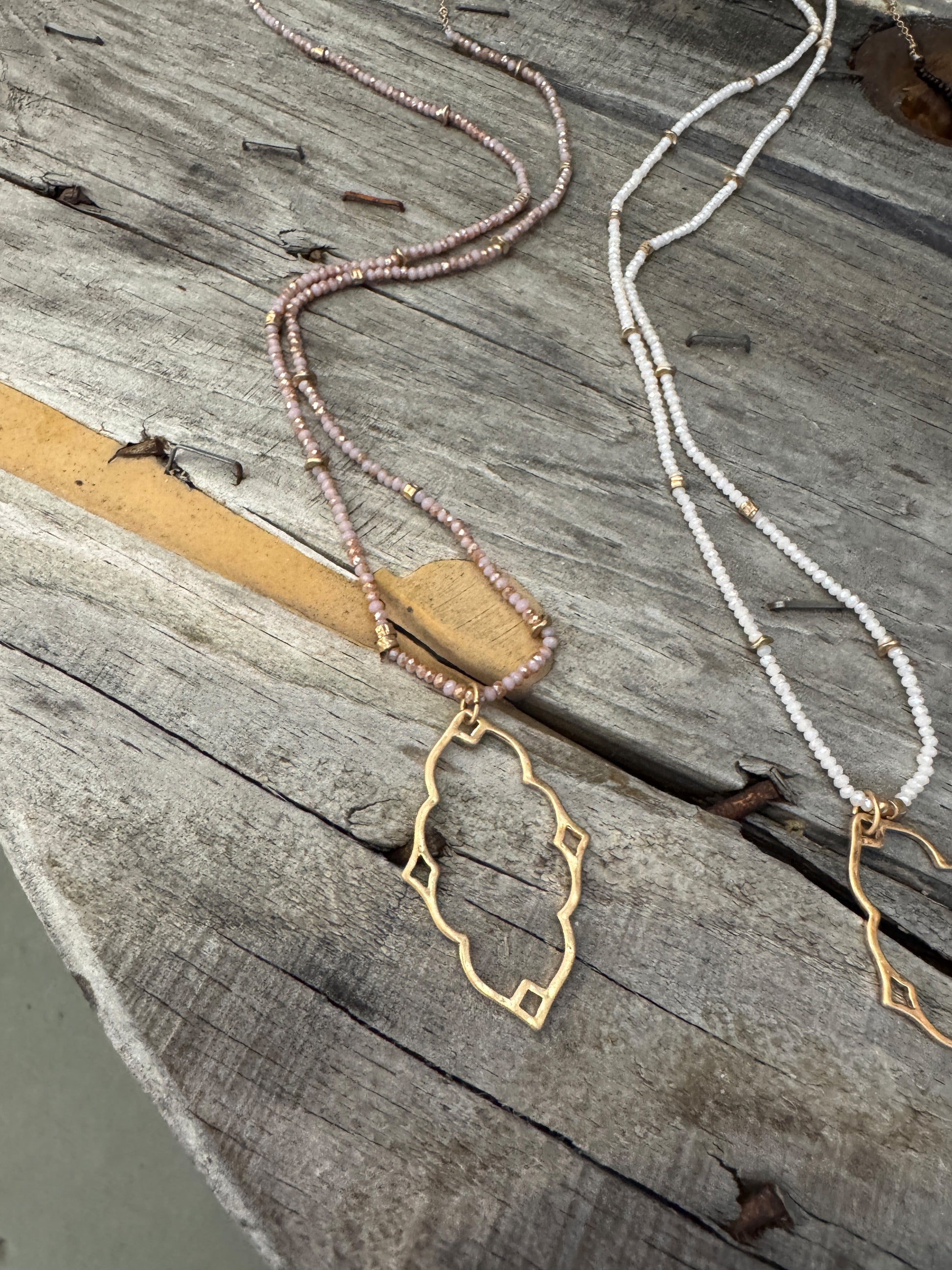 “Dainty Days beaded necklace in pink”

“Elegant black beaded chain necklace from B7 Boutique”

“White subtle beaded necklace, perfect for layering”