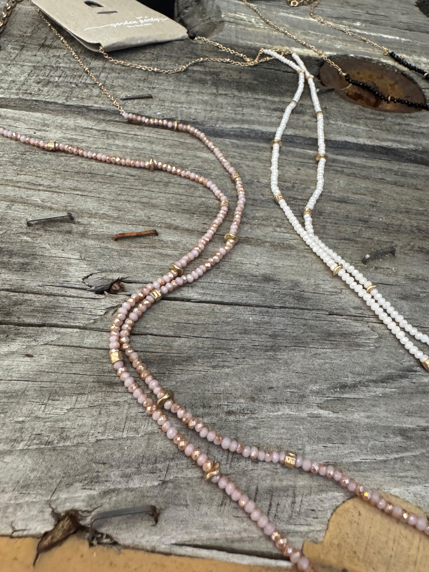 “Dainty Days beaded necklace in pink”

“Elegant black beaded chain necklace from B7 Boutique”

“White subtle beaded necklace, perfect for layering”