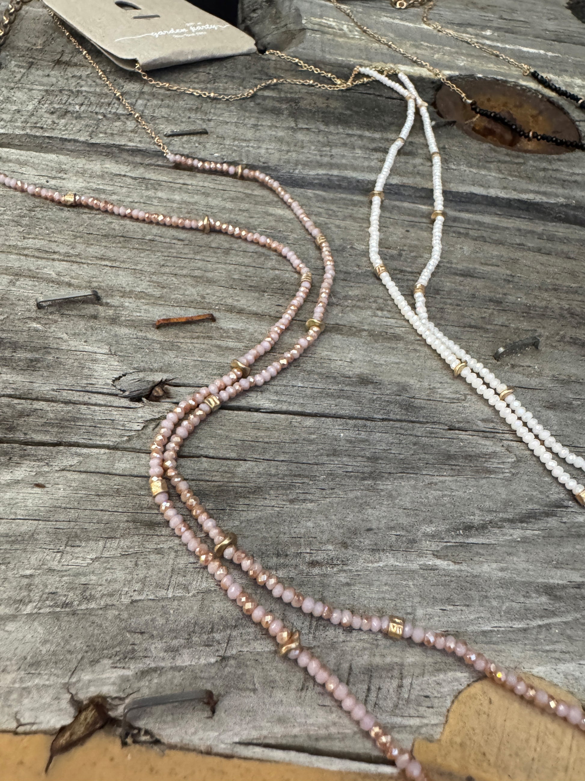 “Dainty Days beaded necklace in pink”

“Elegant black beaded chain necklace from B7 Boutique”

“White subtle beaded necklace, perfect for layering”