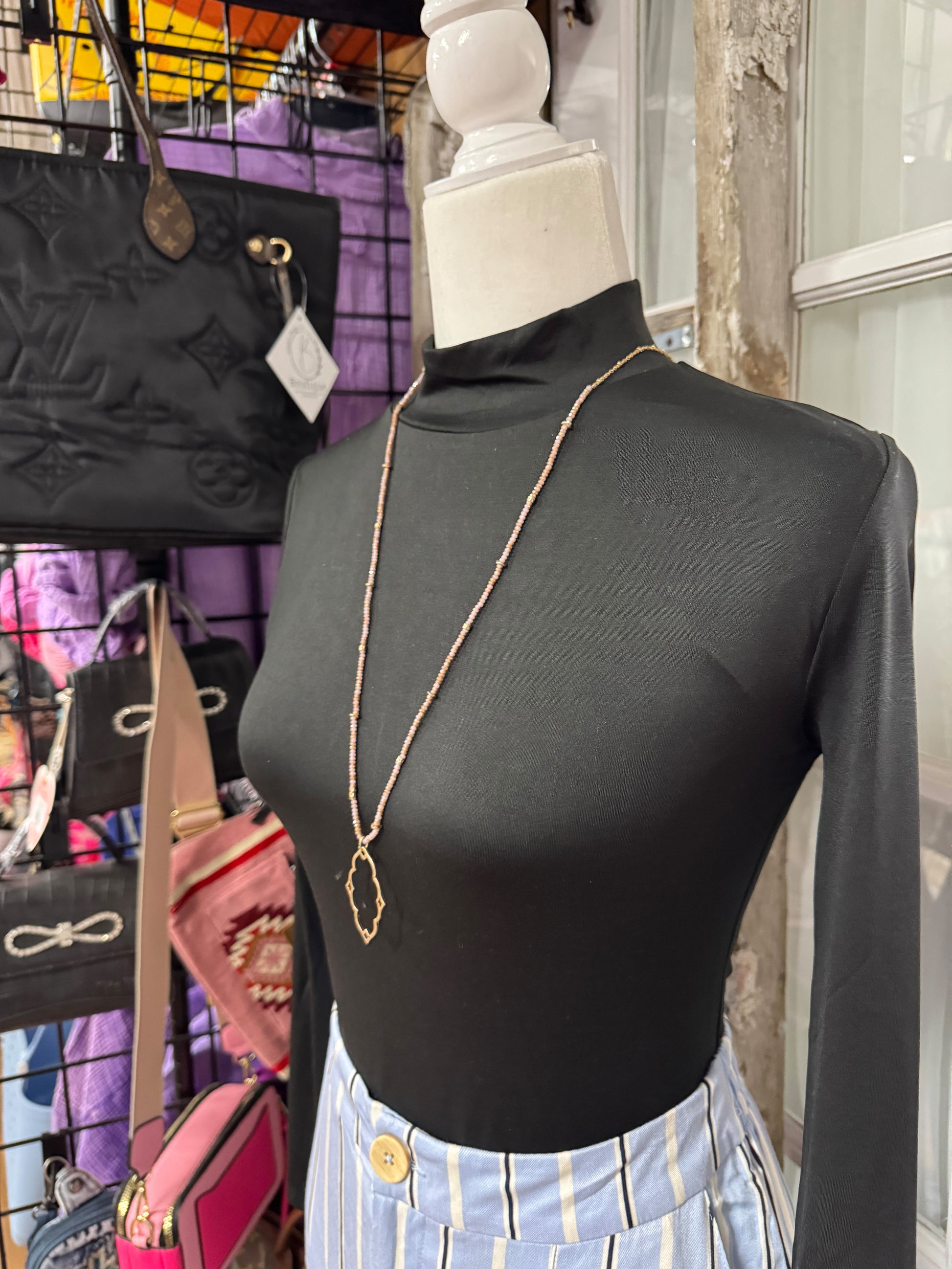 “Dainty Days beaded necklace in pink”

“Elegant black beaded chain necklace from B7 Boutique”

“White subtle beaded necklace, perfect for layering”