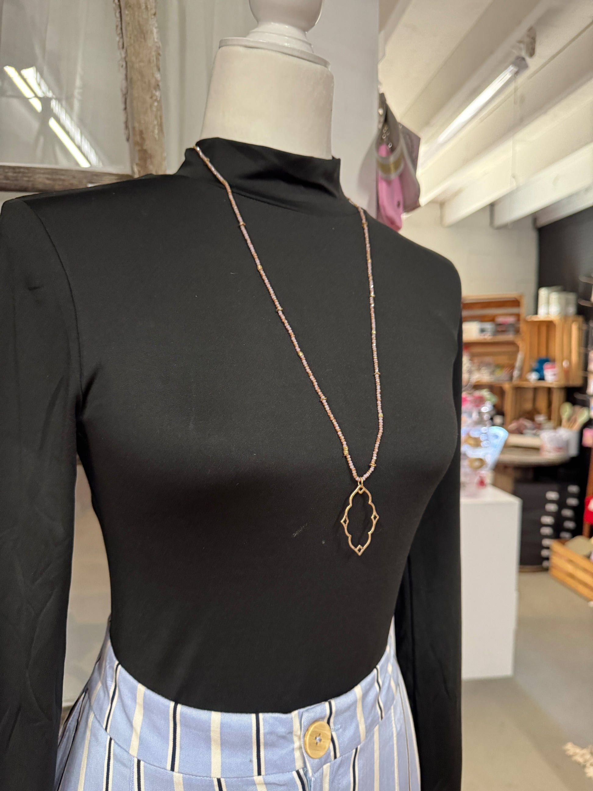 “Dainty Days beaded necklace in pink”

“Elegant black beaded chain necklace from B7 Boutique”

“White subtle beaded necklace, perfect for layering”