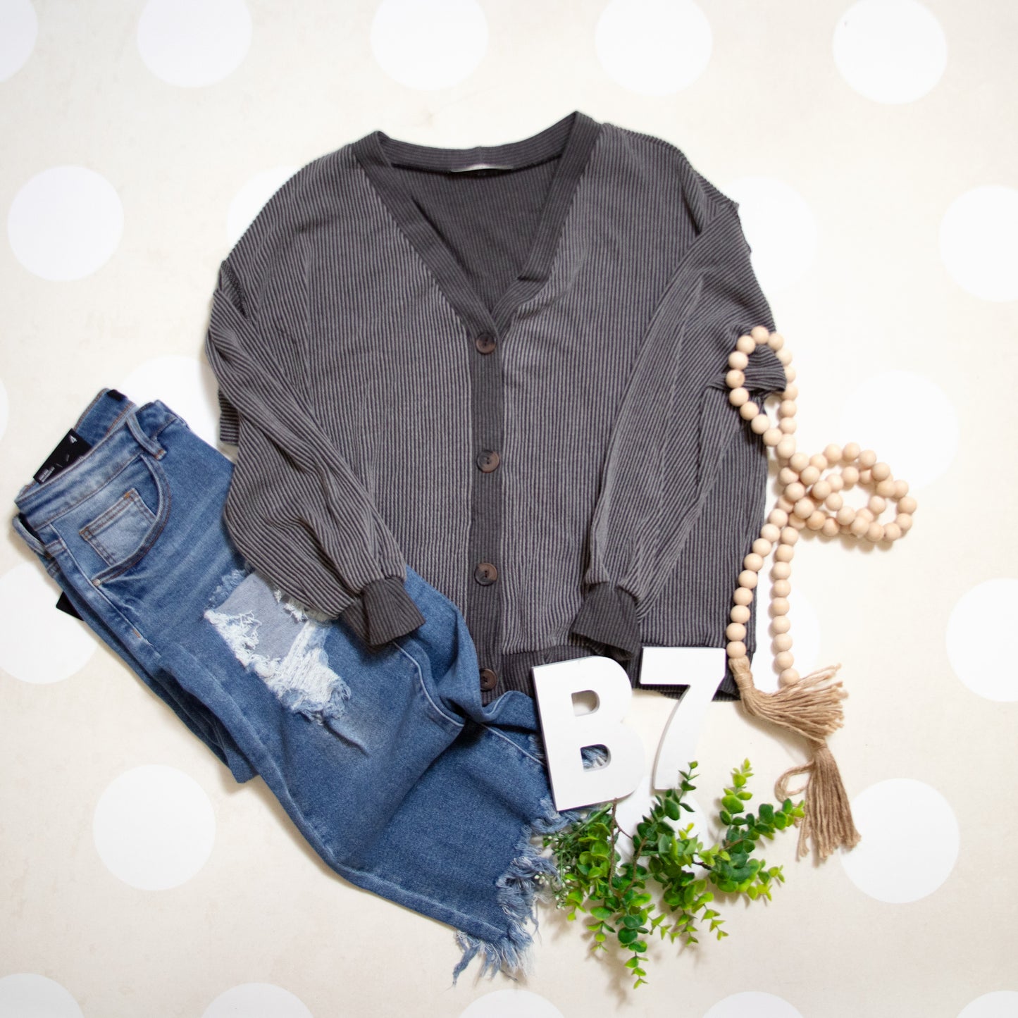 Flat Lay of Black Charcoal Cozy Confidence Button Front Top by Stylive with Distressed Jeans and Boho Decor