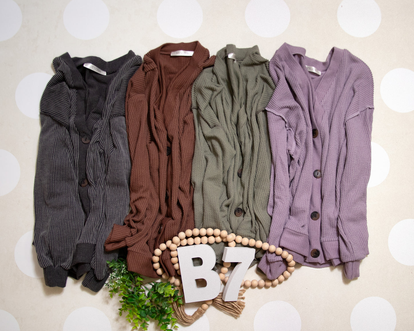 Flat Lay of Black Charcoal Cozy Confidence Button Front Top by Stylive with Distressed Jeans and Boho Decor