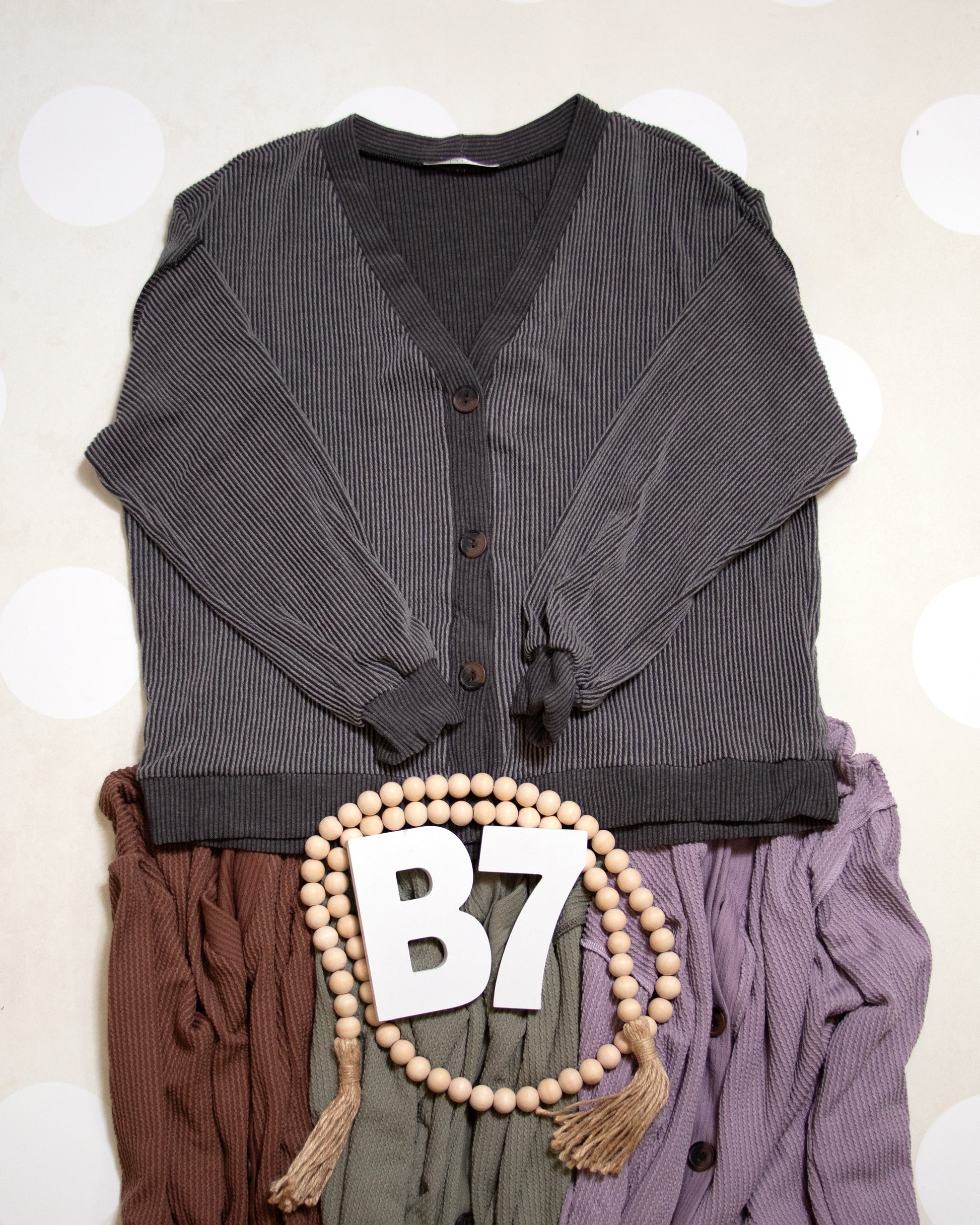 Flat Lay of Black Charcoal Cozy Confidence Button Front Top by Stylive with Distressed Jeans and Boho Decor