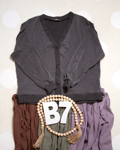 Flat Lay of Black Charcoal Cozy Confidence Button Front Top by Stylive with Distressed Jeans and Boho Decor