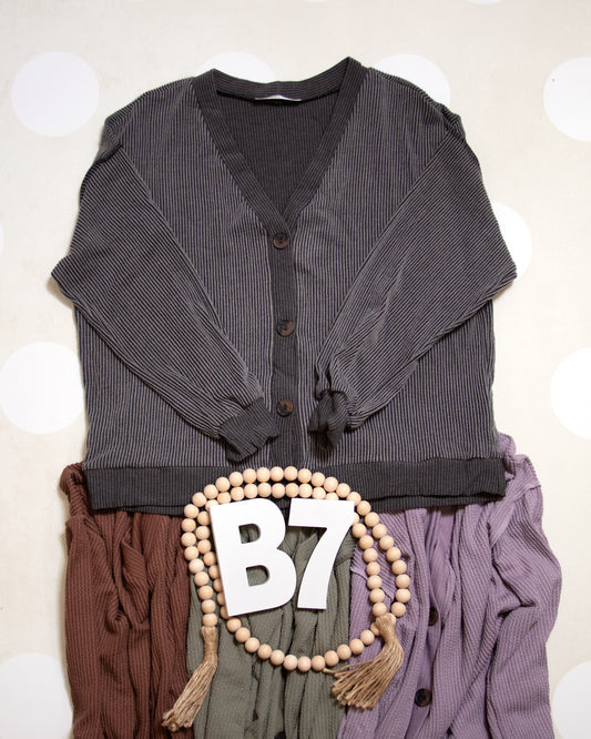 Flat Lay of Black Charcoal Cozy Confidence Button Front Top by Stylive with Distressed Jeans and Boho Decor