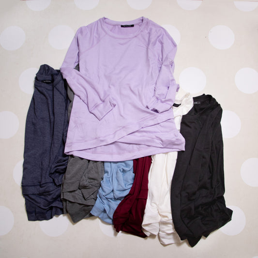 Flat Lay of Everyday Essential Long Sleeve Top by Stylive in Lilac with Jeans and Boutique Decor