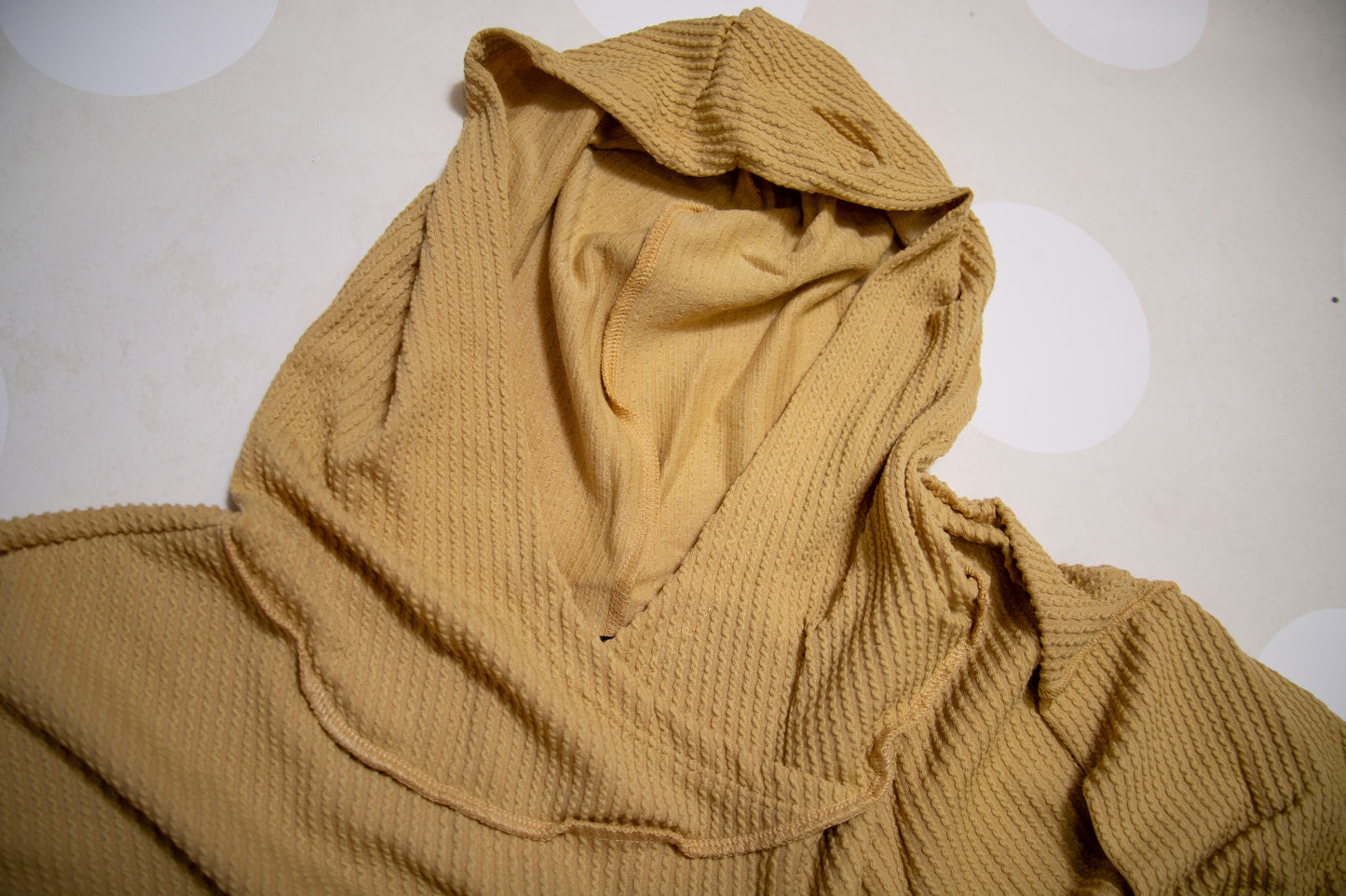 Flat Lay of Mustard Stay Cozy Soft Textured Hoodie by Stylive with Distressed Jeans and Boho Boutique Decor