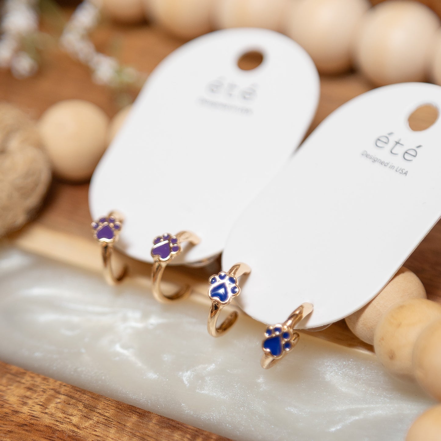 Pawfect Spirit Huggie Earrings | Blue & Purple Paw Print Hoop Earrings