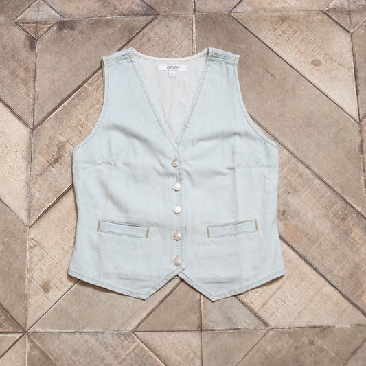 Light blue vest on a tiled floor