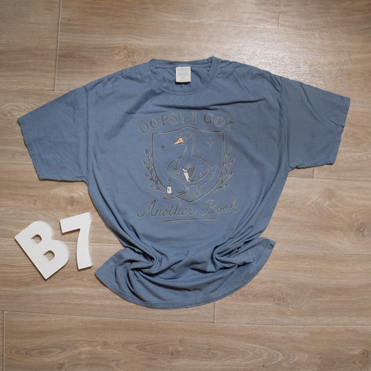 Oops! I Got Another Book Tee – Funny Goose Reader Graphic Shirt