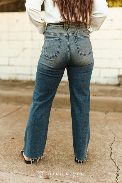 vintage wash mid rise straight leg cropped jeans with raw hem