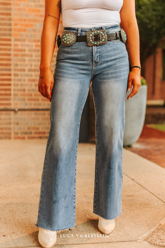 plus size light wash high rise wide leg jeans with frayed hem