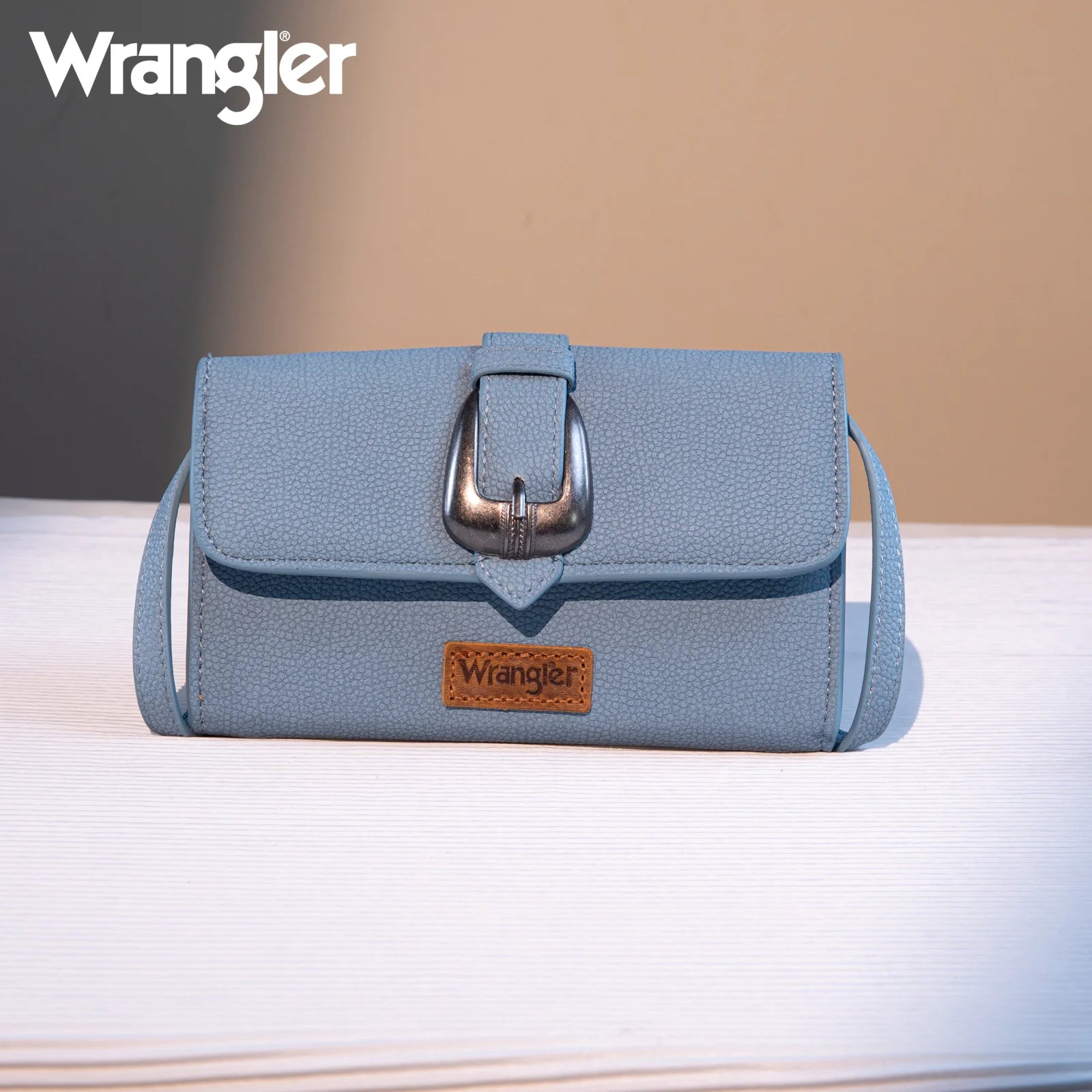 “Wrangler buckle wallet crossbody with button-flap closure”
“Compact Convertible crossbody wallet with Wrangler logo buckle”
“Mini shoulder bag wallet with card slots and detachable strap”