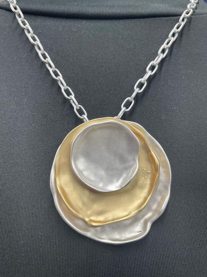 “Layered mixed metal gold and silver necklace”

“Dish Me Up mixed metal layered chain from B7 Boutique”

“Two-tone chain necklace with gold accents and silver links”