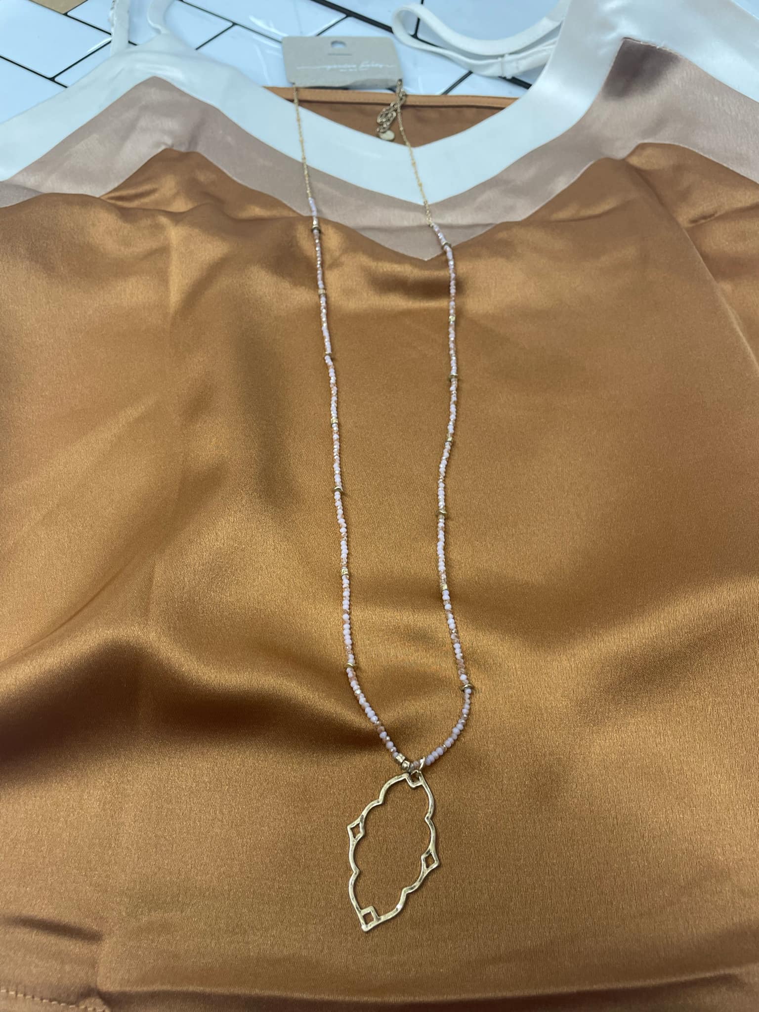 “Dainty Days beaded necklace in pink”

“Elegant black beaded chain necklace from B7 Boutique”

“White subtle beaded necklace, perfect for layering”