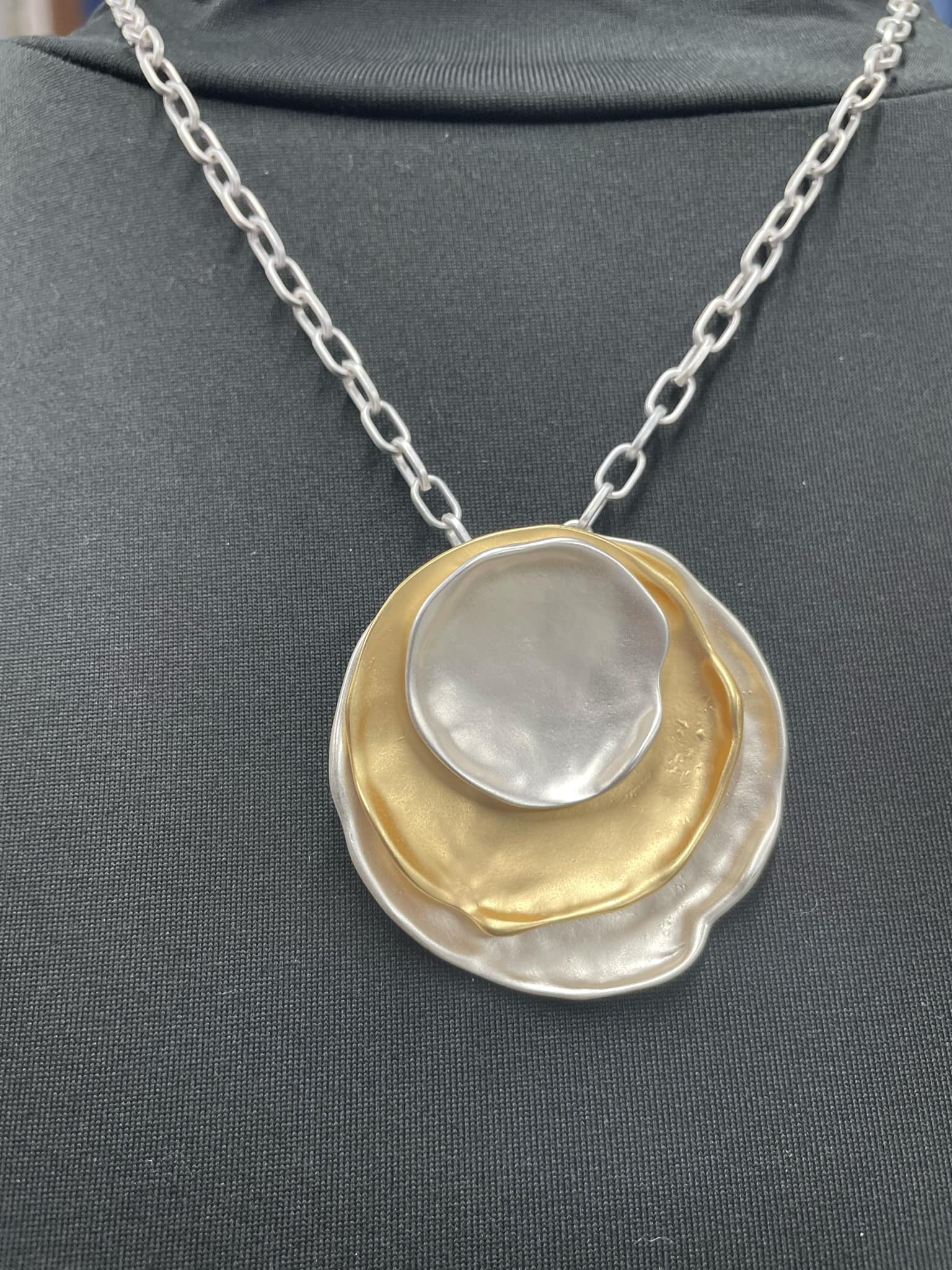 “Layered mixed metal gold and silver necklace”

“Dish Me Up mixed metal layered chain from B7 Boutique”

“Two-tone chain necklace with gold accents and silver links”