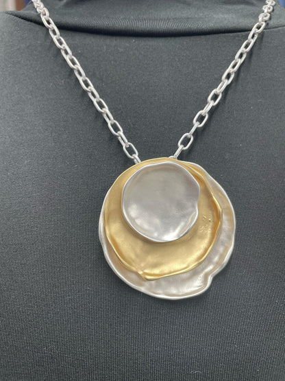 “Layered mixed metal gold and silver necklace”

“Dish Me Up mixed metal layered chain from B7 Boutique”

“Two-tone chain necklace with gold accents and silver links”