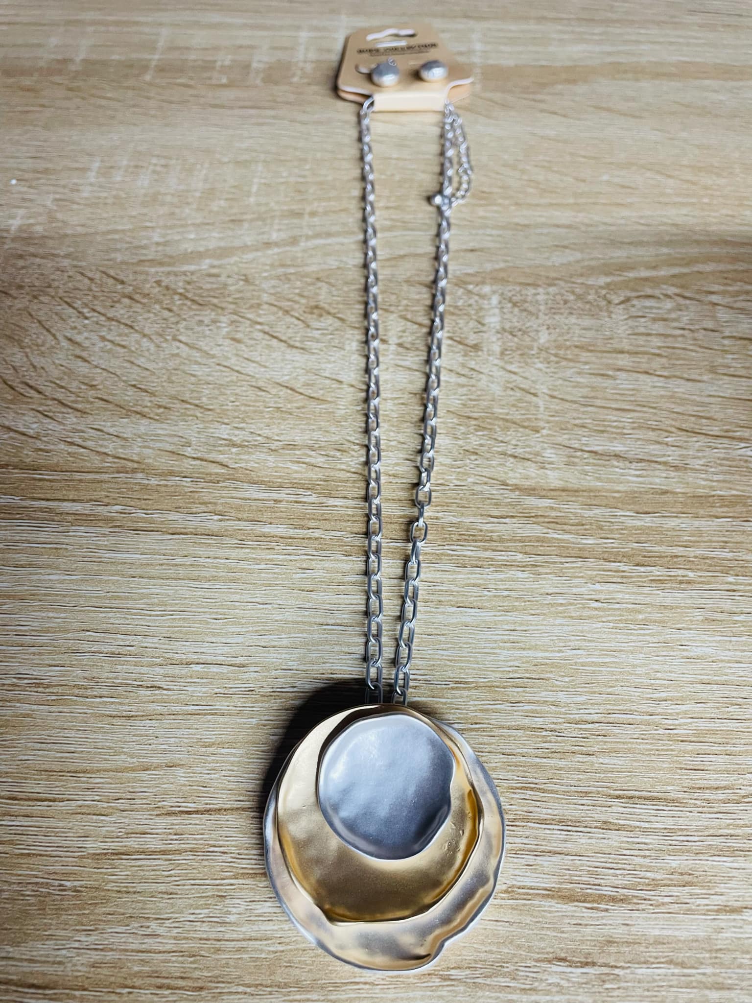 “Layered mixed metal gold and silver necklace”

“Dish Me Up mixed metal layered chain from B7 Boutique”

“Two-tone chain necklace with gold accents and silver links”