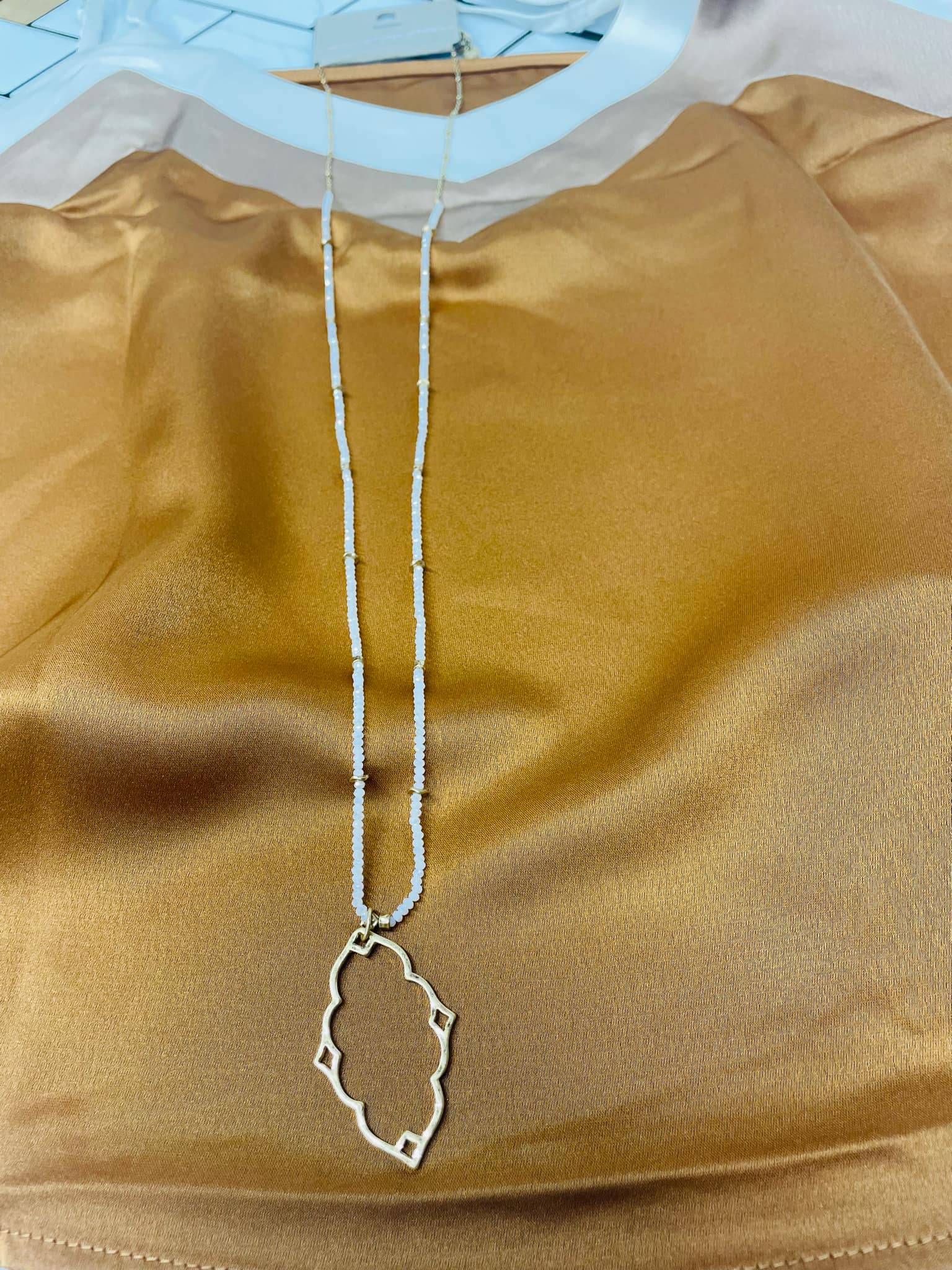 “Dainty Days beaded necklace in pink”

“Elegant black beaded chain necklace from B7 Boutique”

“White subtle beaded necklace, perfect for layering”