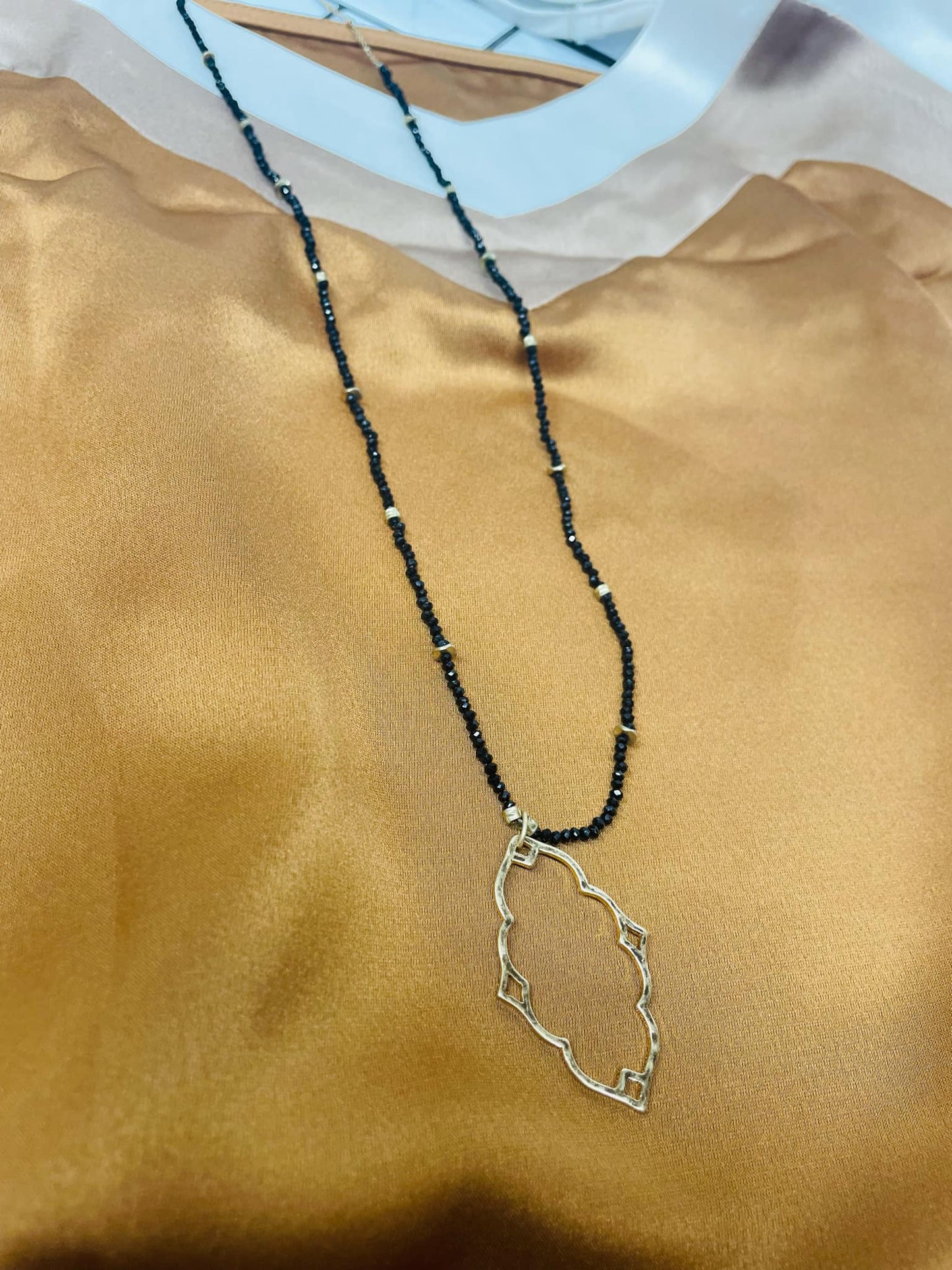 “Dainty Days beaded necklace in pink”

“Elegant black beaded chain necklace from B7 Boutique”

“White subtle beaded necklace, perfect for layering”