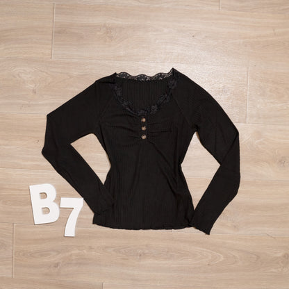 Black ribbed long sleeve henley top with lace neckline and button detail