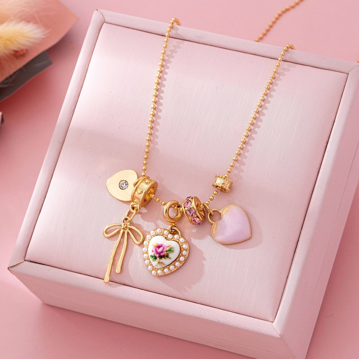 Rose Charm Cluster Necklace | Gold Plated Heart & Bow Necklace