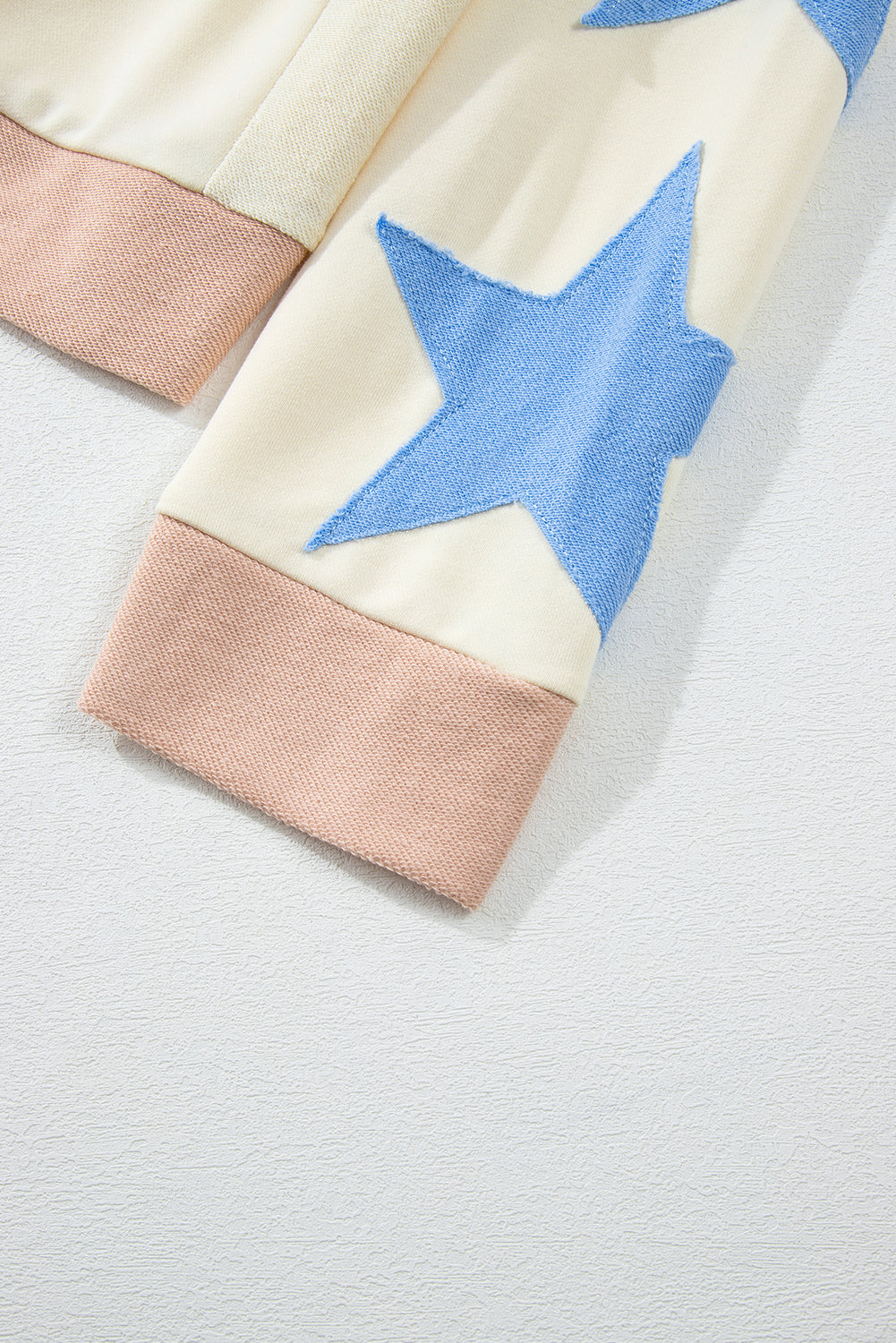 Beige Star Contrast Patchwork Long-Sleeve Top – Relaxed Fit with Exposed Seams