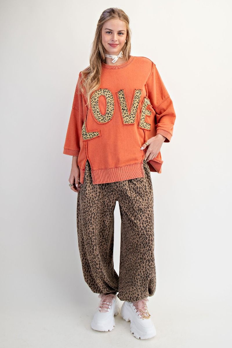 Soft relaxed fit sweatshirt with bold LOVE patch