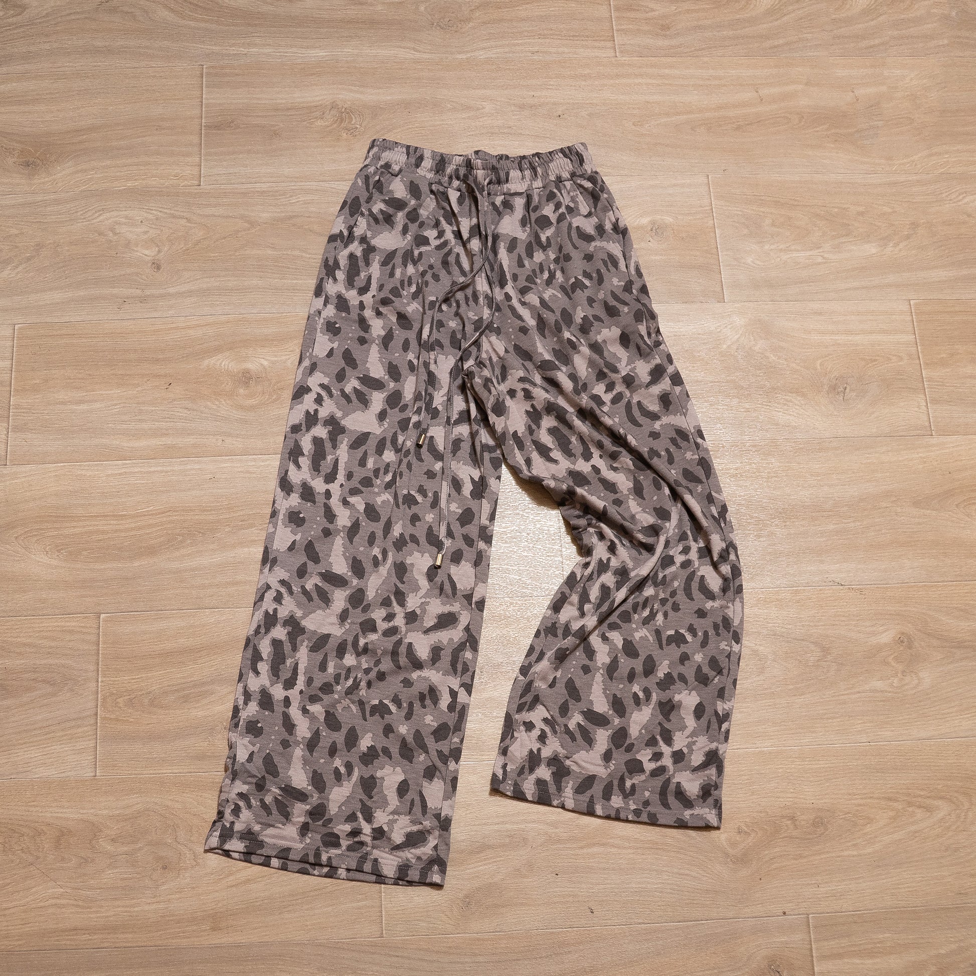 Neutral leopard print two piece lounge set with long sleeve top and elastic waist bottoms