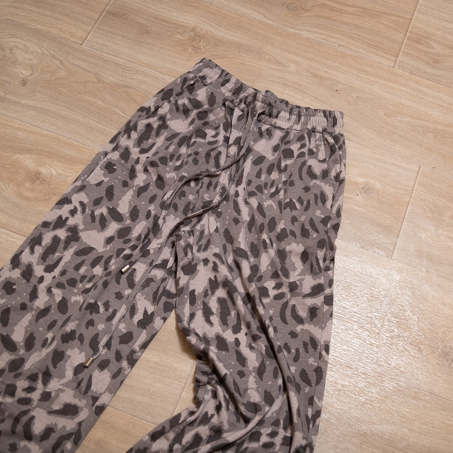 Neutral leopard print two piece lounge set with long sleeve top and elastic waist bottoms
