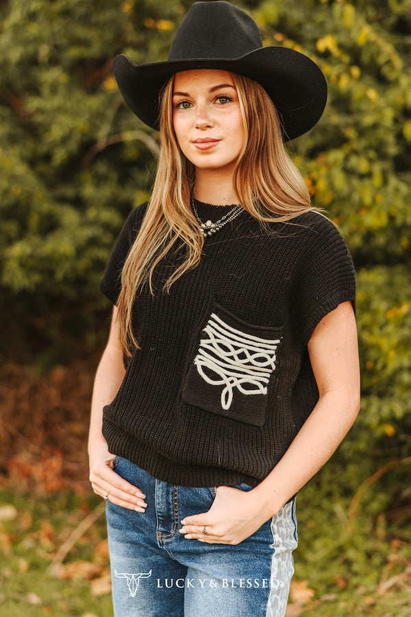 black knit western top with embroidered back detail